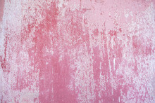 A Pink Painted Wall Worn With Age.