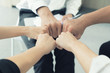 © ake1150 - Hand partnership business team giving Fist Bump after complete deal business project