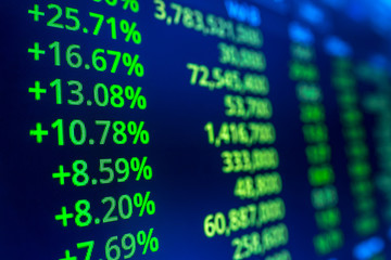 Stock market graph analysis. Stock market data on LED display on laptop screen for finance and economic. Business graph background.