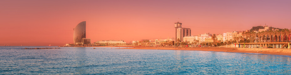 Wall Mural - barceloneta beach in barcelona at sunrise, spain
