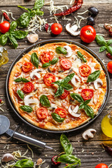 Canvas Print - Pizza decorated with basil leaves