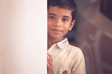 Wall Mural - Portrait of Indian Little boy Posing to Camera with Expression