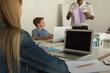 © Wavebreak Media - Male pilot training kids in training institute