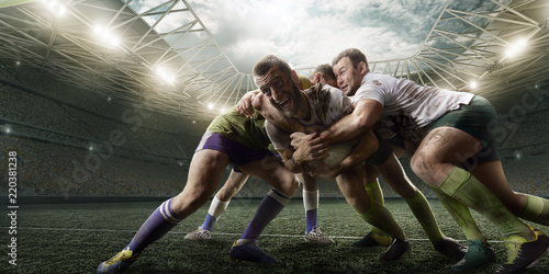 Plakaty Rugby  gracze-rugby-walcza-o-pilke-na-profesjonalnym-stadionie-rugby