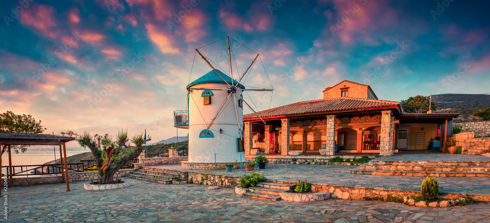Obraz na płótnie Picturesque morning scene of the countryside with windmill. Colorful spring sunrise on the Zakynthos island, Korithi location, Ionian Sea, Greece, Europe. Beauty of countryside concept background. w salonie