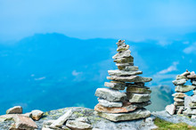Stack Of Balancing Stones On The Top Of A Mountain In French Pyrenees With A View To Downhills.