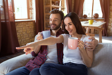 happy young couple relax at modern home living room indoor. Couple in love - Beginning of a Love Story