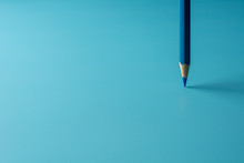 Blue Crayon Pencil Stand On Blue Paper Background. - Business Concept