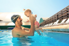 Happy Family Having Fun By The Swimming Pool. Pool, Leisure, Swimming, Summer, Recreation, Healthy Lifstyle Concept