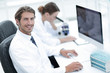 © ASDF - Young male technician working on computer in laboratory