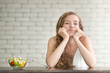 © amenic181 - Beautiful young woman in joyful postures with salad bowl on the side