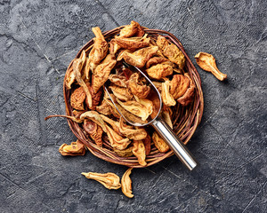 Wall Mural - Dried pear, apple on black table. Top view.