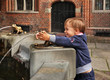 Child near Raftsman Fountain (Pomnik flisaka) in Torun.  Poland