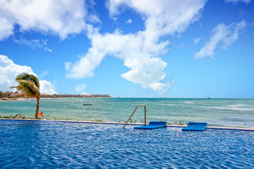 Wall Mural - Blue Floats at Edge of Pool by the Sea