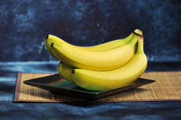 Wall Mural - bunch of ripe bananas on a plate