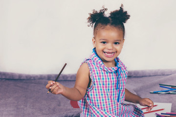 Wall Mural - Beautiful child enjoying painting