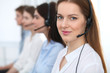 © rogerphoto - Call center. Beautiful cheerful smiling operator consulting clients with headset. Business concept of customer service