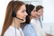 © rogerphoto - Call center. Beautiful cheerful smiling operator consulting clients with headset. Business concept of customer service