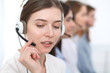 © rogerphoto - Call center. Beautiful cheerful smiling operator consulting clients with headset. Business concept of customer service