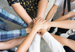 © Thammasiri - Team work concept. Business people joining hands