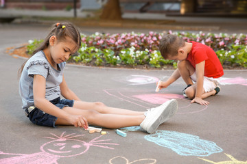 Poster - Little children drawing with colorful chalk on asphalt