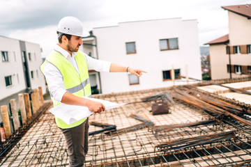 Wall Mural - Construction industry details with male engineer working