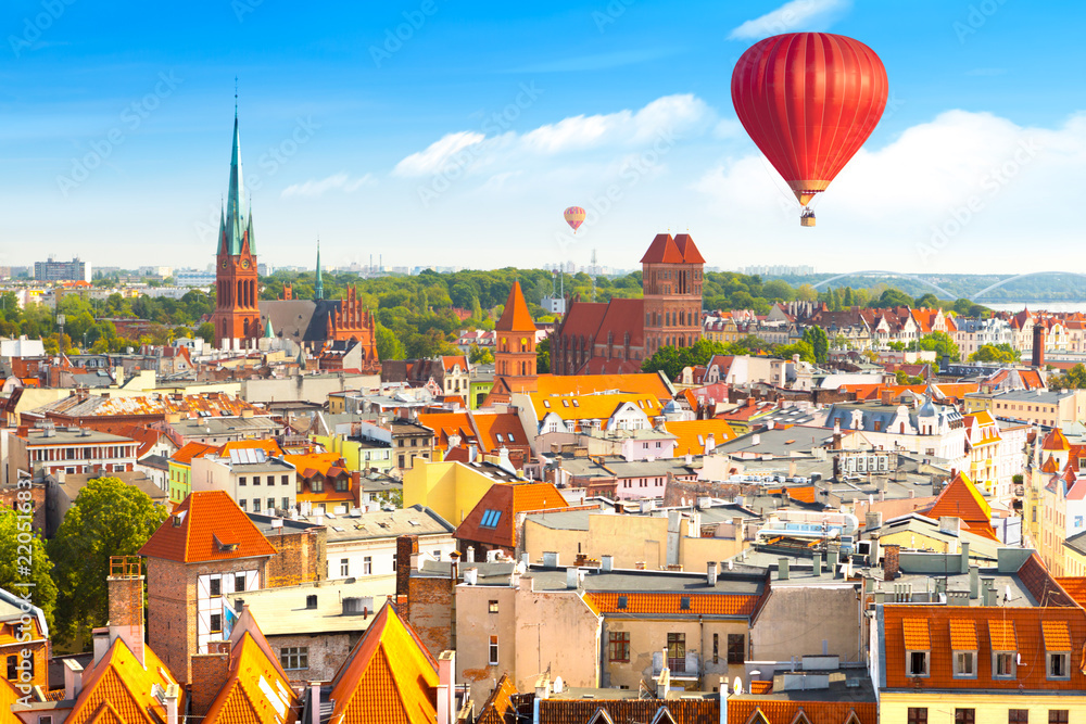 Obraz na płótnie Aerial panoramic view of historical buildings and roofs in Polish medieval town Torun w salonie