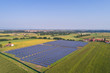 Photovoltaic system in a fields, aerial view with drone