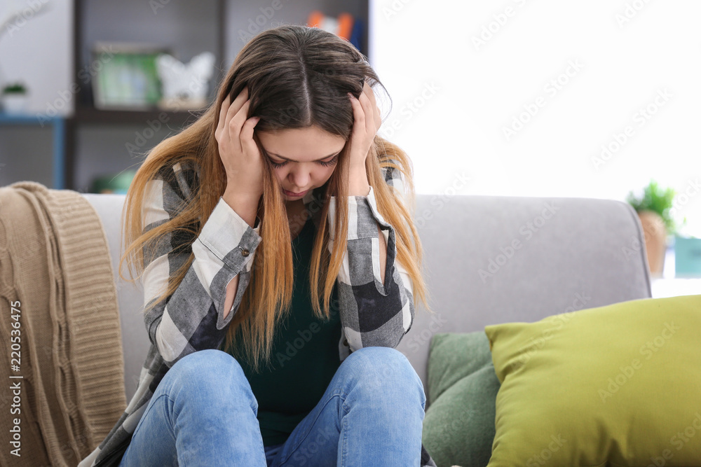 Upset teenage girl at home