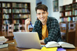 © Africa Studio - Student with laptop studying in library