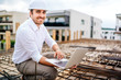 Close up details of architect using laptop on building construction site