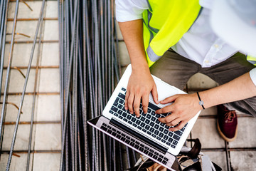 Wall Mural - close up details of engineer working on laptop on construction site