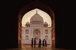 Tourists silhouetted in front of Taj Mahal