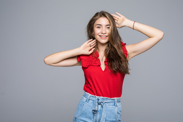 Wall Mural - Young woman casual dressed isolated on grey background