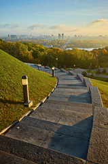 cloudy blue sky over the green park in Kyiv. Landscape shot. Park of Eternal Glory, Kiev.