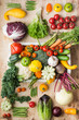 © Liliya Trott - Assortment of fresh colorful organic vegetables in white tray on wooden pine table, creative food background, vertical, top view, selective focus