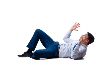 Businessman lying on the floor isolated on white