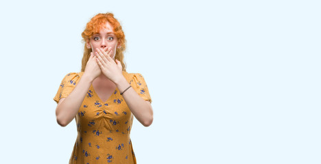 Wall Mural - Young redhead woman shocked covering mouth with hands for mistake. Secret concept.