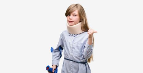 Sticker - Young blonde child injured wearing neck collar and crutches pointing with hand and finger up with happy face smiling