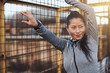 © Flamingo Images - Sporty Asian woman taking a break outdoors from exercising
