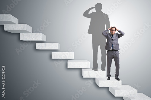 Fotografering Businessman and his shadow in business concept
