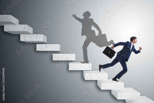 Businessman and his shadow in business concept Lerretsbilde