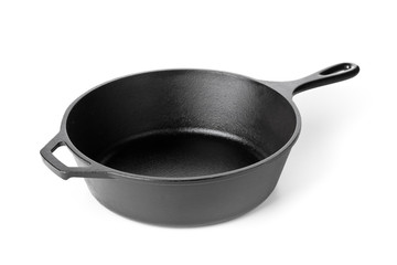 Empty, clean black cast iron pan or dutch oven over white