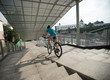 © lzf - Woman freerider riding down ramp of overpass in city