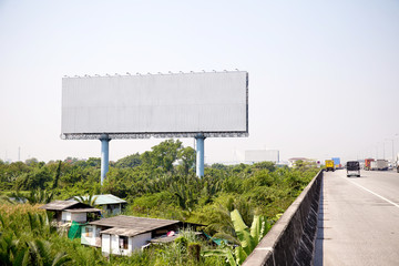 Wall Mural - blank billboard on the sideway in the park. image for copy space, advertisement, text and object. white billboard in natural green.