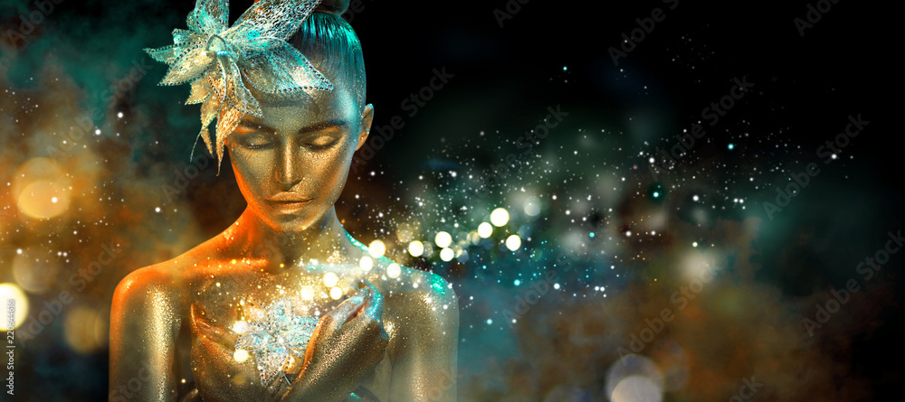 Fashion model woman in colorful bright golden sparkles and neon lights posing with fantasy flower. Portrait of beautiful girl with glowing makeup - obrazy, fototapety, plakaty 