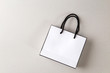 © PRASERT - white shopping bag one white background and copy space for plain text or product