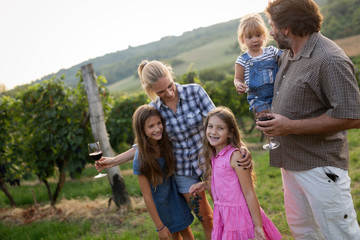 Wall Mural - Winemaker family together in vineyard