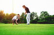 © zorandim75 - Young couple playing golf