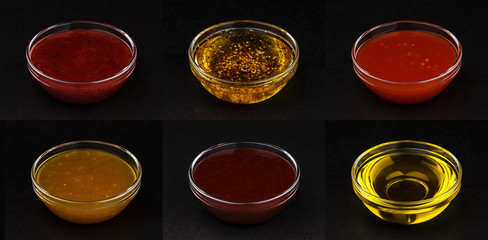 Wall Mural - Different sauces isolated on black background